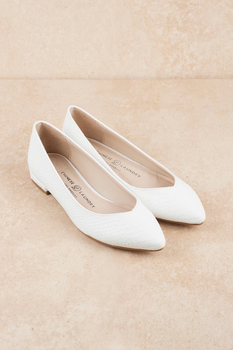 white pointed flats