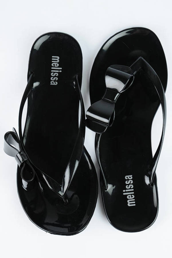 black plastic flip flops