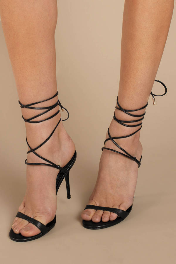 black heels with straps up the leg