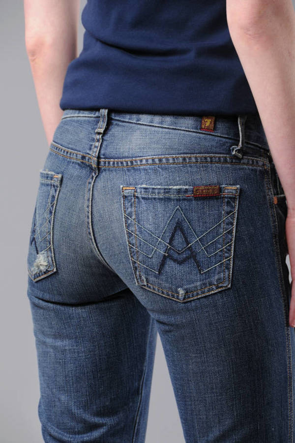 jeans with black tag on back pocket